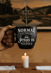a mug that says normal is not coming back jesus is on it