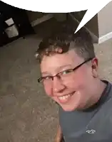 a young boy wearing glasses and a hollister shirt smiles