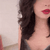 a close up of a woman 's face with red lips