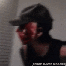 a blurry picture of a person with the words deuce 9 lives discord