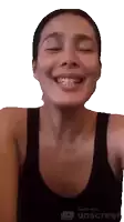 a woman wearing a black tank top is smiling and made with unscreen