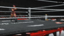a woman in a boxing ring with the words back in 154 on the bottom right