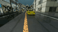 a yellow car is driving down a street with a yellow line in the middle