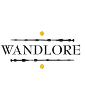 a logo for wandlore with two wands and a yellow ball