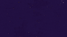 a cartoon character is laying on the ground watching fireworks