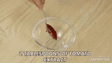 a pan filled with meatballs on a red napkin with the words made in animatica on the bottom
