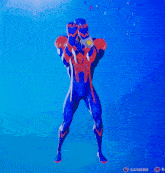 a blue and red superhero standing in front of a camera