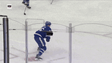 a hockey player with the number 46 on his jersey stands next to another player
