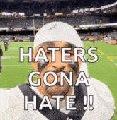 a football player with a bandana on his head says haters gona hate !