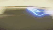 a dark background with a blue light coming out of the top