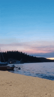 a sunset over a body of water with a dock in the foreground
