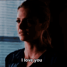 a woman says i love you with a tear running down her face