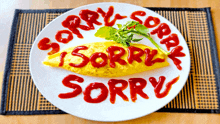 a plate of food with sorry written in ketchup