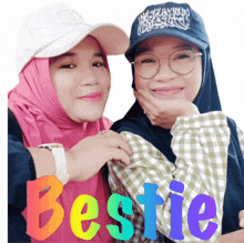 two women posing for a picture with the word bestie in the corner