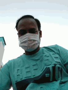 a man wearing a face mask and a shirt that says ' jeep ' on it