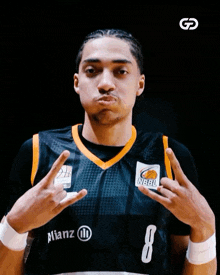 a basketball player wearing a jersey that says nbbl on it