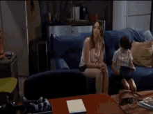 a woman is opening a door in a living room .