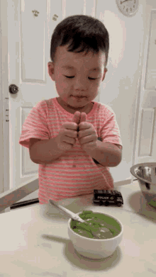 a little boy playing with a toy police car