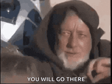 a man with a beard is wearing a hooded jacket and a helmet .