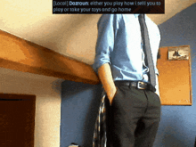 a man in a blue shirt and tie is hanging from a ceiling with a text box above him that says local