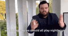 a man with a beard is explaining why we should all play nightreign .
