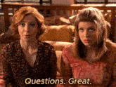 two women are sitting next to each other and one of them says " questions. great "