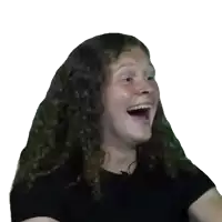 a girl with long curly hair is laughing with her mouth open