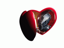 a heart shaped mirror with a picture of deadpool