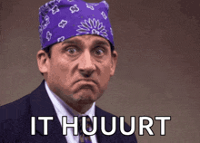 a man wearing a purple bandana and a suit says it huuurt