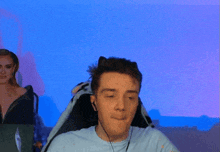 a man wearing headphones is making a fist