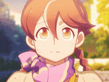 a close up of a girl 's face with a pink scarf around her neck