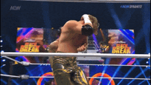 a wrestling match is being shown on a aew channel