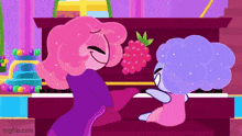 two cartoon characters are playing a piano with a raspberry on it .