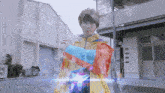 a man in a colorful jacket is standing in front of a building with the number 11 on it