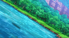 a river surrounded by trees and rocks with a cliff in the background