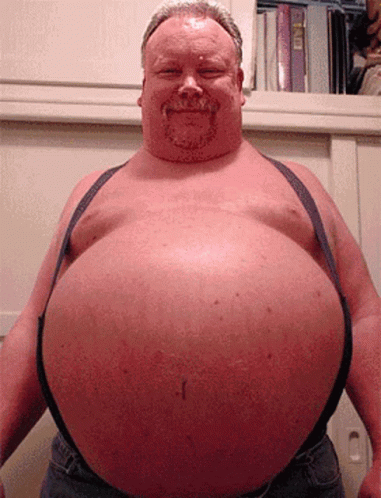 a man with a big belly is smiling and wearing suspenders