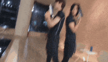 a blurry picture of a man and a woman dancing