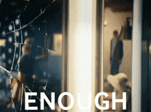 the word enough is on a poster with a broken glass