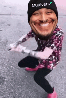 a man wearing a beanie and a floral shirt is making a funny face while dancing .