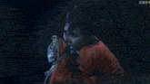 a woman in a red kimono is holding a sword in her hand with a kiss k logo in the background