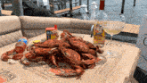 crabs on a table with a bottle of olde hickory sauce