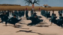 a blurry picture of a group of people dancing in a field