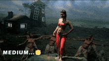 a group of women are dancing in front of a windmill and the word medium is on the bottom left
