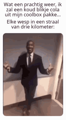a man in a suit and tie with his arms outstretched