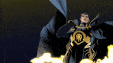 a man in a black and gold superhero costume stands in front of flames