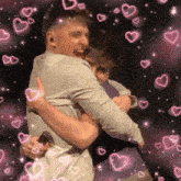a couple of men hugging each other with pink hearts surrounding them
