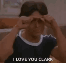 a young man is making a funny face and says `` i love you clark '' .
