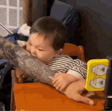 Baby Eating Tattoo Arm GIF - Baby Eating Tattoo Arm Zeheons GIFs