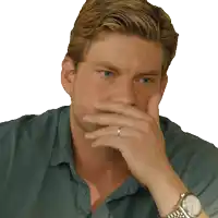 a man wearing a watch and a ring on his finger covers his mouth