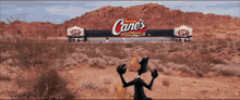 a cartoon duck stands in front of a canes sign